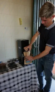 Wesley grinding coffee