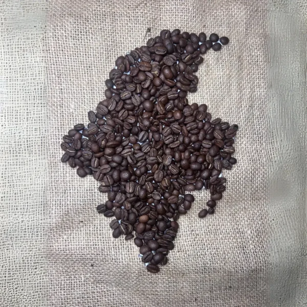 Map of Colombia made from coffee beans with a coffee sack background