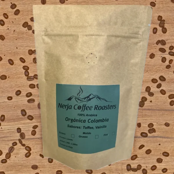 Bag of Organic colombian coffee on a table with coffee beans